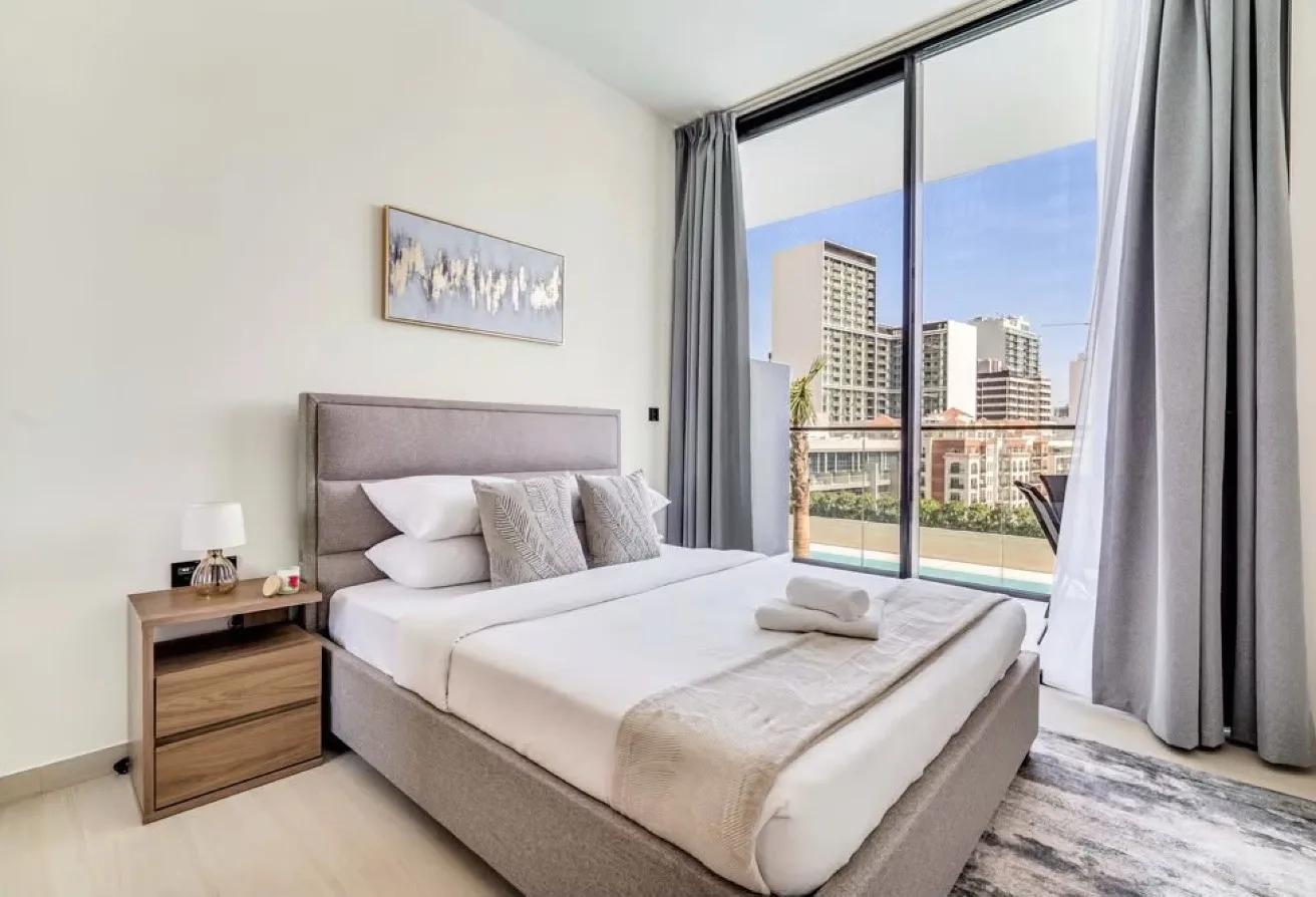 Binghatti Onyx JVC — bedroom with Dubai skyline view