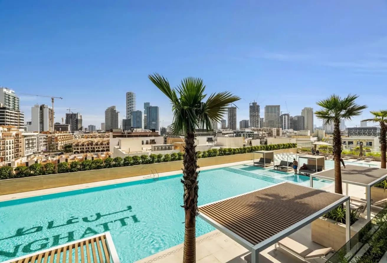 Binghatti Onyx JVC — rooftop swimming pool with skyline view